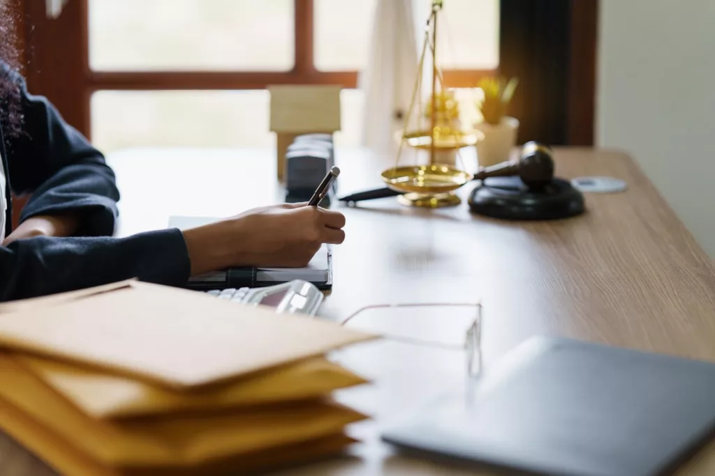 Car accident lawyer at desk – why hire an attorney after a car accident