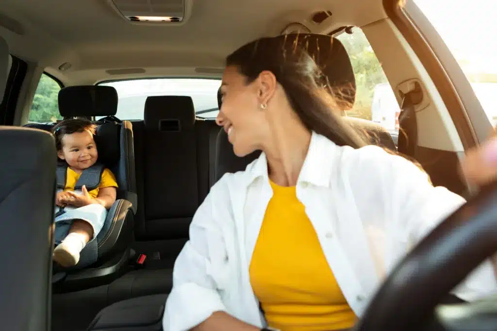 Young child buckled safely in a car seat inside a vehicle