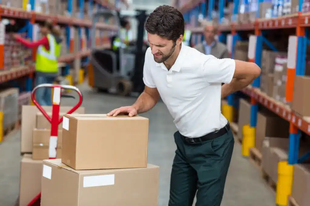 Worker with back injury lifting boxes in warehouse – Florida workers' compensation