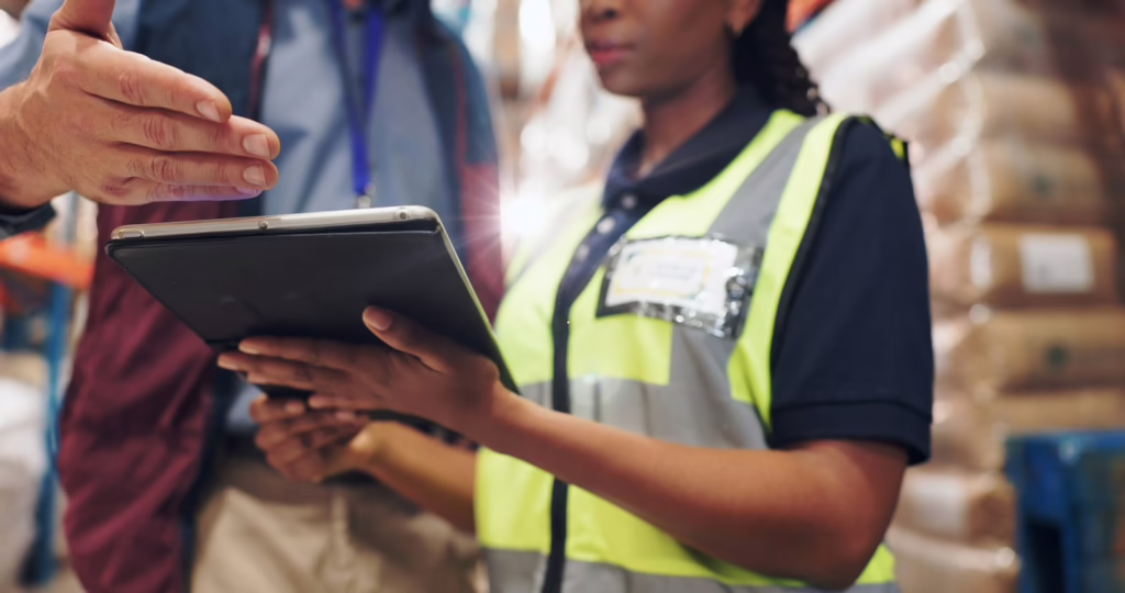 Worker in safety vest at warehouse – common causes of workplace accidents