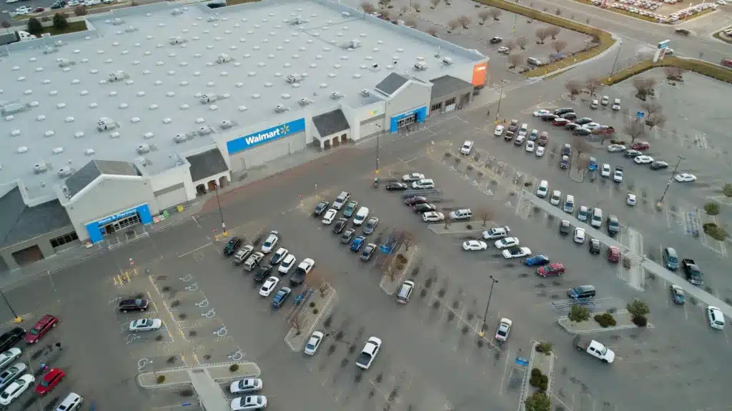An aerial view of a Walmart storefront and parking lot illustrating a retail store slip and fall accident and big box premises liability injury claim.